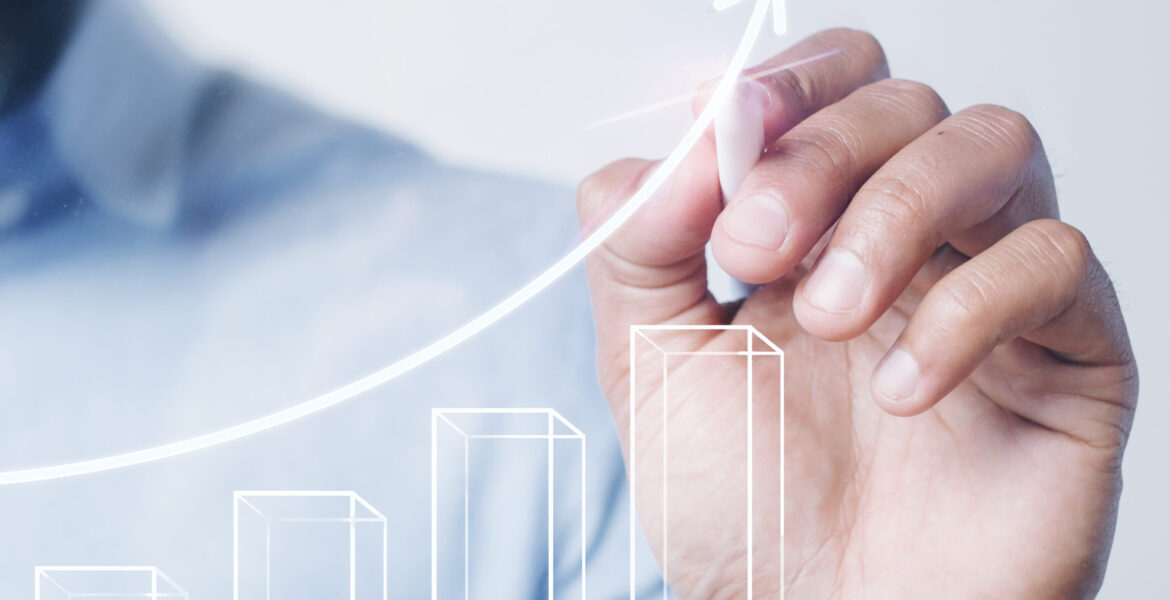 Man giving a bar graph presentation using a high technology digi